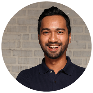 man wearing navy polo tshirt well groomed smiling