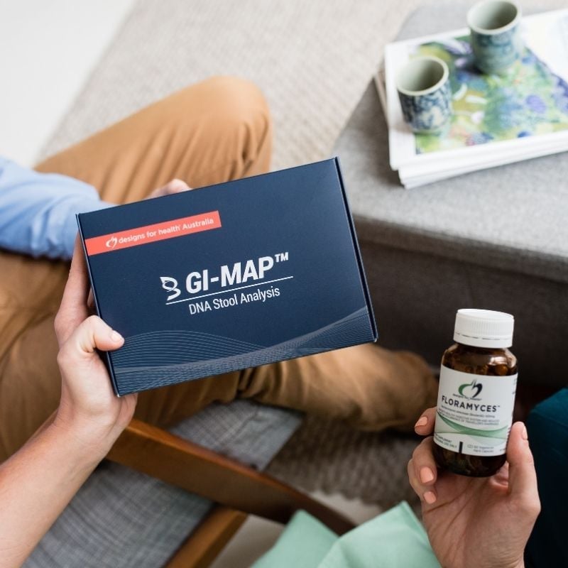coeliac-functional-medicine-root-cause functional medicine practitioner holding gi map dna stool analysis kit practice manager holding floramyces probiotics
