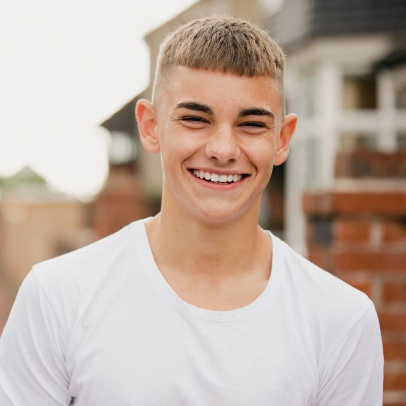 eczema-gut-health-case-study young male big smile wearing white tshirt