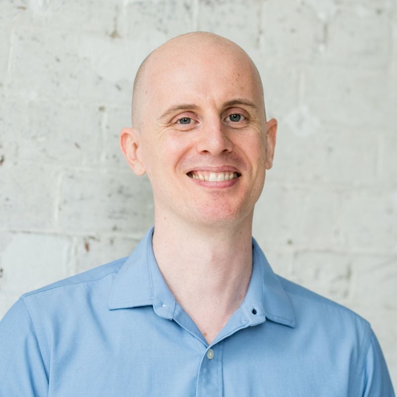 jabe-brown-press-hero jabe brown functional medicine practitioner wearing blue shirt smiling
