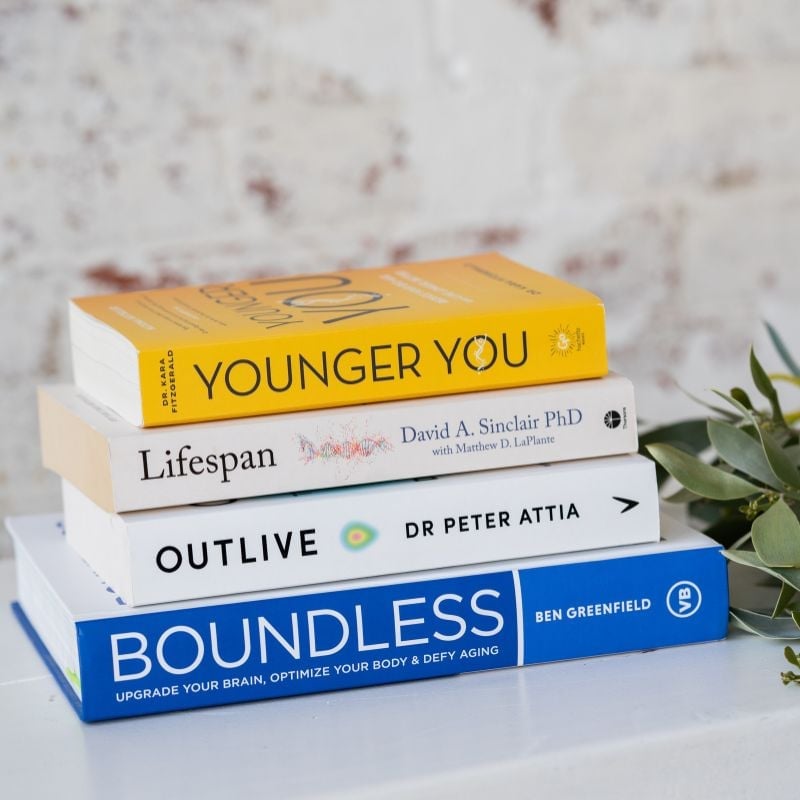 stack of books about health and longevity