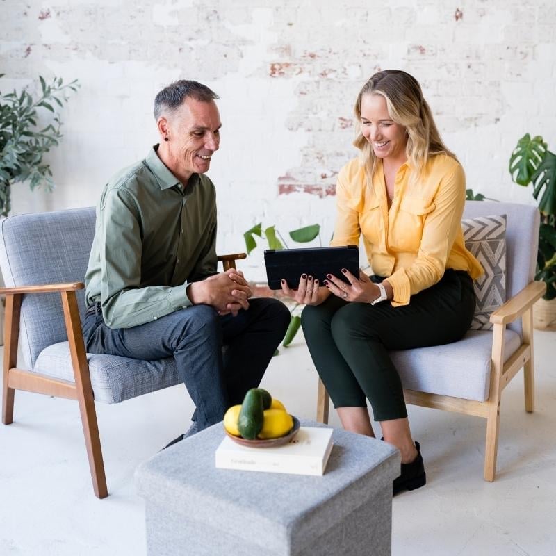 functional medicine practitioner health coach looking at tablet