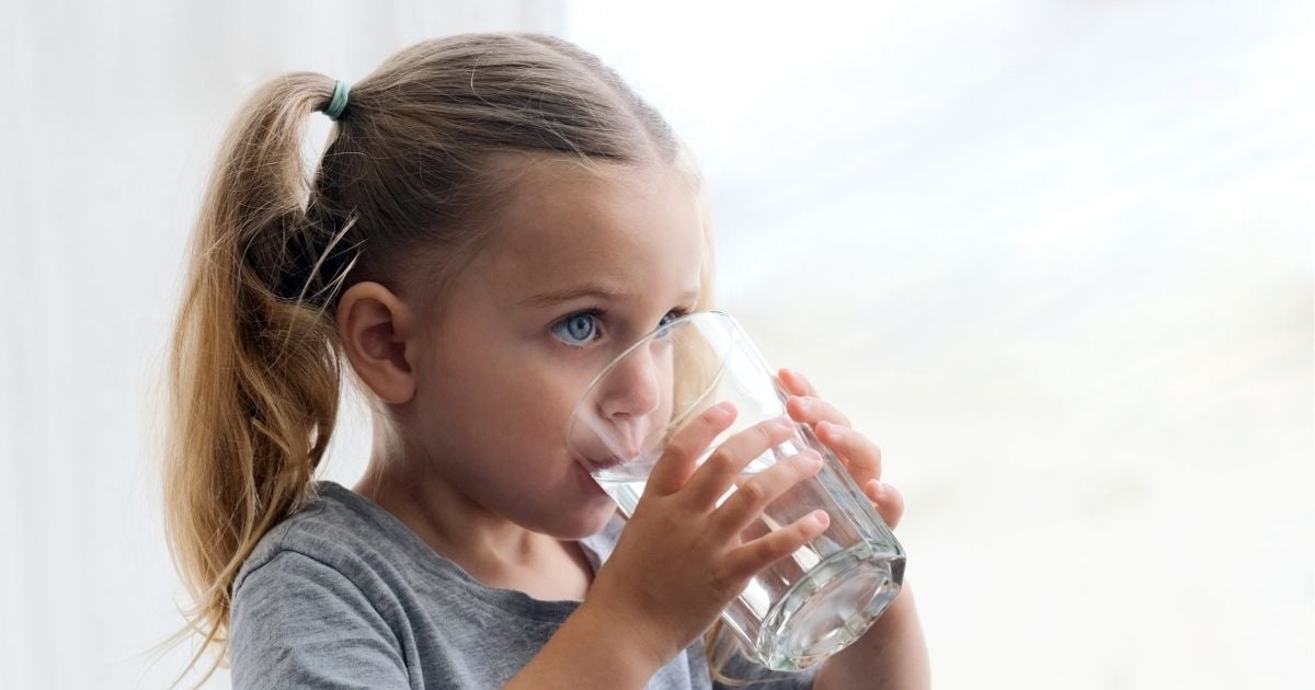 fluoridated water being poured into clear glass